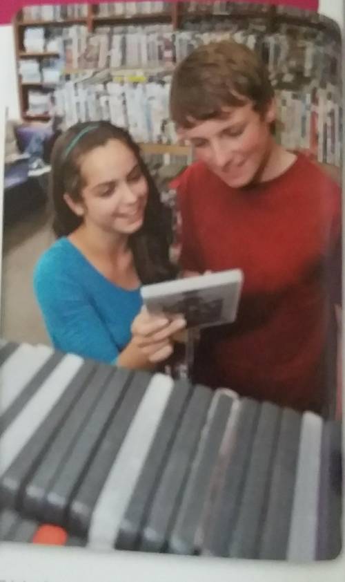 Look at the photo. Where are Tom and Caitlin? What are they doing?